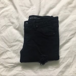 black mid-rise distressed jeggings